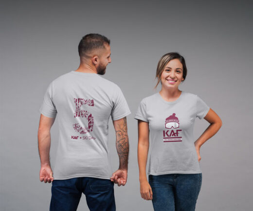 Two people posing in custom designed KAF Ski Day t-shirts