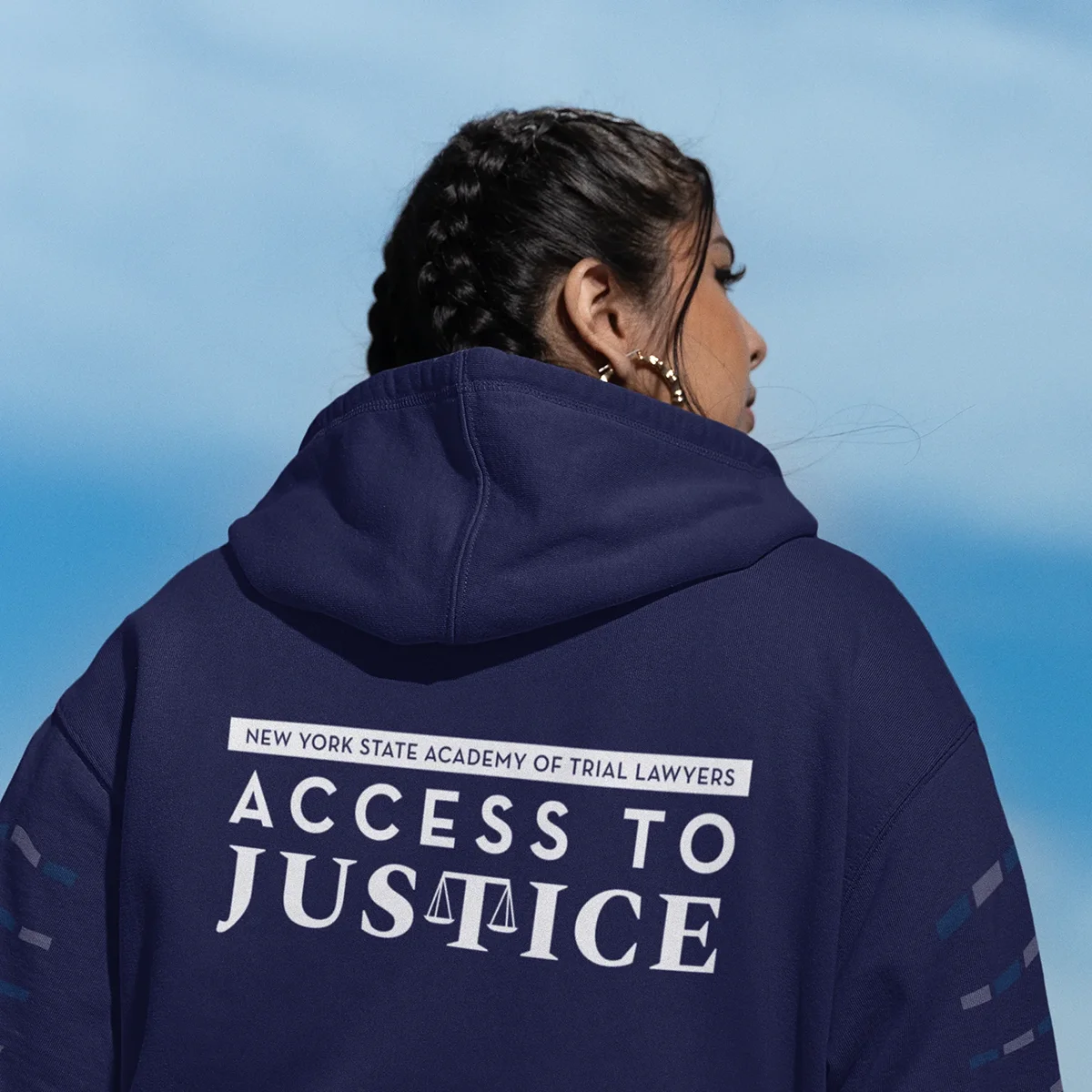 Access-To-Justice-Hoodie Women wearing a blue Access to Justice Sweatshirt
