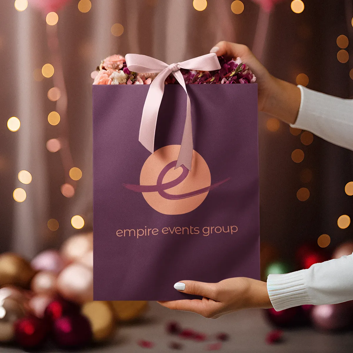 EEG-gift-bag Mock-up of a package with Empire Events Group branding.